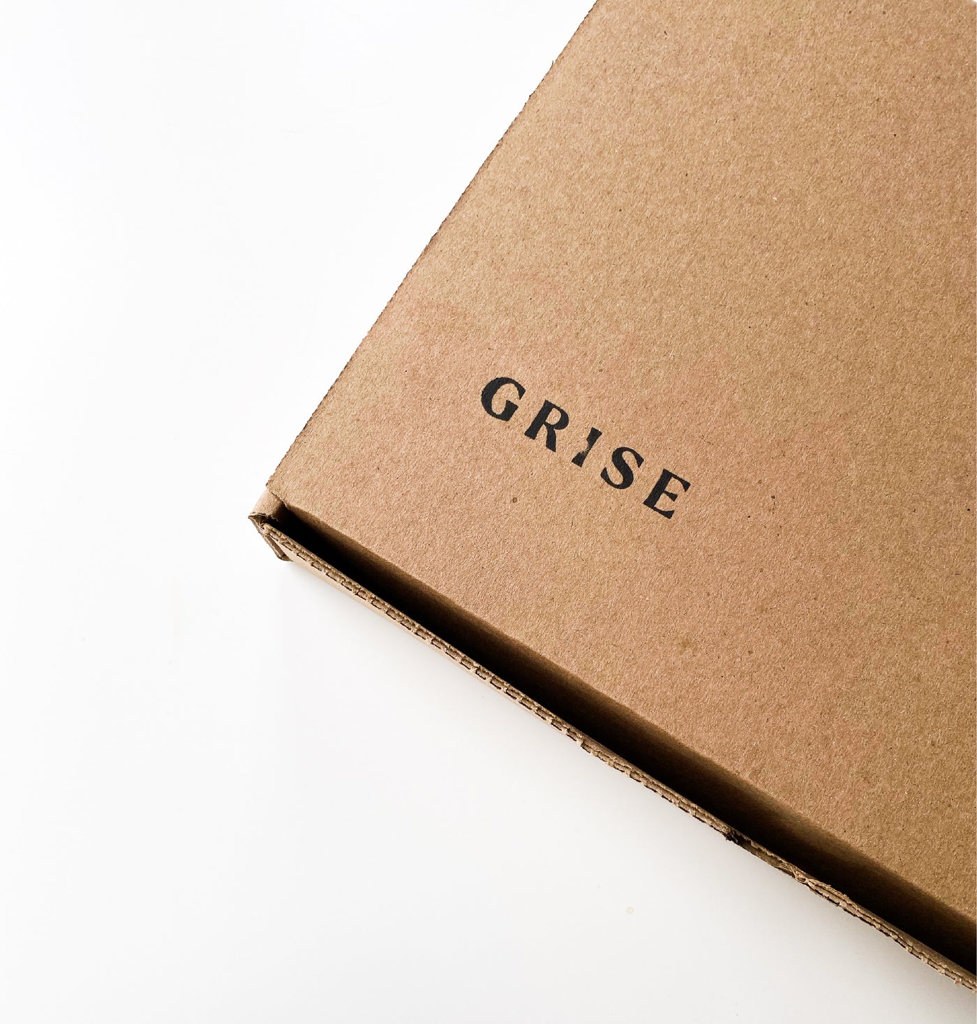 Cardboard box with Grise logo